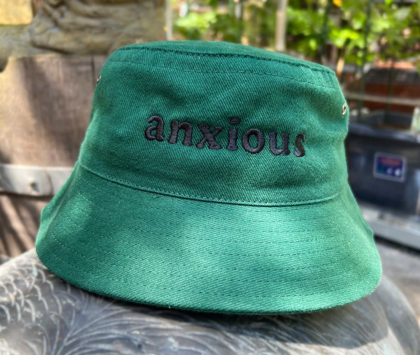 Bucket of Anxiety - Cooked Concepts (the best hat for sun protection, but a warning to others your anxiety is a thing. Bottle green with black embroidery saying ANXIOUS)